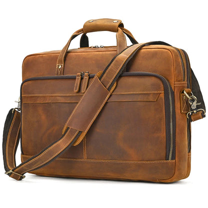 Brown leather briefcase with shoulder strap on a white background